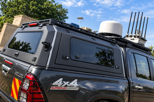 Black aluminum canopy fitted to a Toyota Hilux pickup truck in Uganda