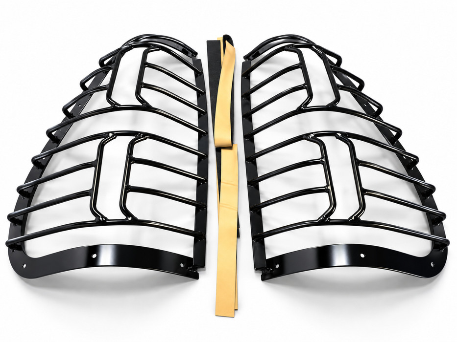 Pair of black metal tail lamp guards for vehicle rear light protection in Uganda